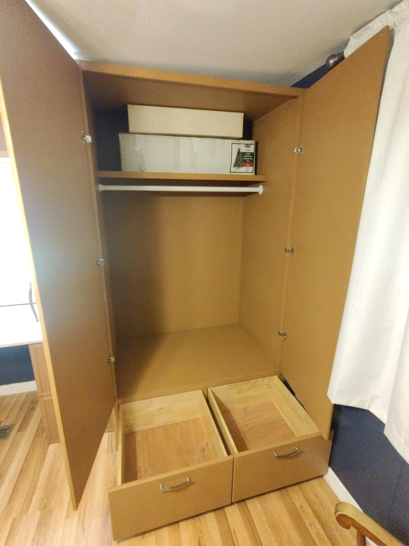 Open cabinet showing shelves and drawer compartments
